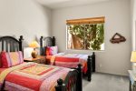 Bedroom 2 is beautifully furnished with two twin beds